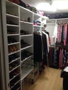 walkin closet with shoe shelves and metal basket drawers